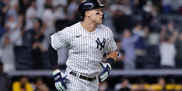 New York Yankees' Aaron Judge watches his 60th home run of the season, during the ninth inning of the team's baseball game against the Pittsburgh Pirates on Tuesday, Sept. 20, 2022, in New York.