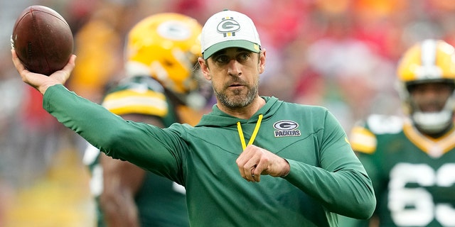 Aaron Rodgers, #12 of the Green Bay Packers, throws a pass before a preseason game against the New Orleans Saints at Lambeau Field on August 19, 2022, in Green Bay, Wisconsin.