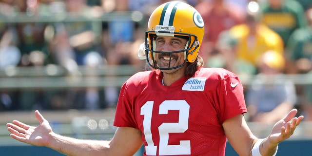 Green Bay Packers quarterback Aaron Rodgers, #12, has some fun during training camp at Ray Nitschke Field Aug. 2, 2022, in Ashwaubenon, Wisconsin.