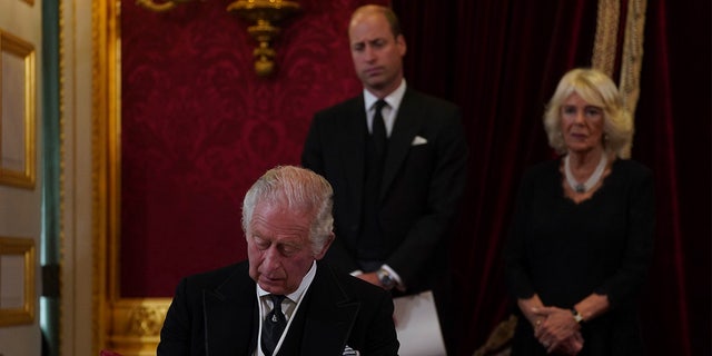 King Charles III signs an oath to uphold the security of the Church in Scotland during the Accession Council at St James's Palace, London, Saturday, Sept. 10, 2022, where he is formally proclaimed monarch. 