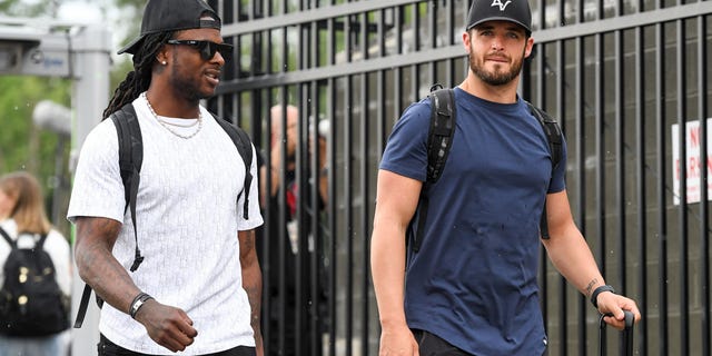 Davante Adams (L) and Derek Carr of the Las Vegas Raiders enter the stadium prior to the 2022 Pro Hall of Fame Game against the Jacksonville Jaguars at Tom Benson Hall Of Fame Stadium on August 04, 2022, in Canton, Ohio.