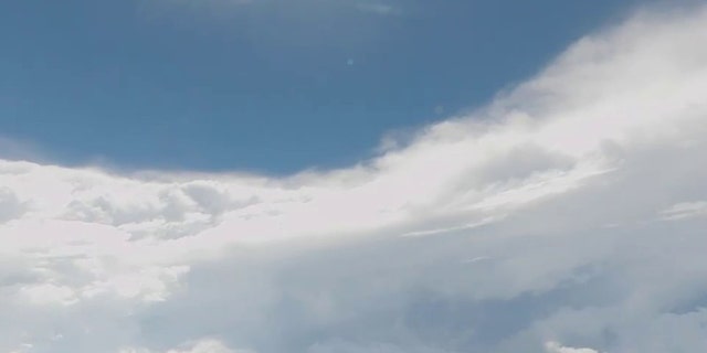 An Air Force squadron flew into Hurricane Ian Tuesday, capturing video of eerie calm and blue skies within the Category 4 storm.
