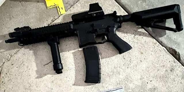 An evidence photo, Saturday, Sept. 17, 2022, released by Los Angeles Police Department shows a rifle collected by LAPD Firearms Analysis Unit personnel in South Los Angeles.