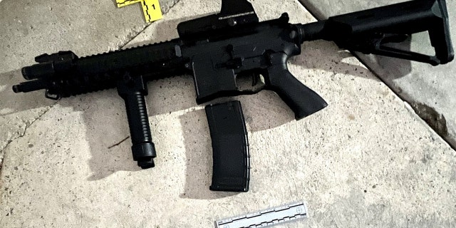 An evidence photo, Saturday, Sept. 17, 2022, released by Los Angeles Police Department shows a rifle collected by LAPD Firearms Analysis Unit personnel in South Los Angeles.