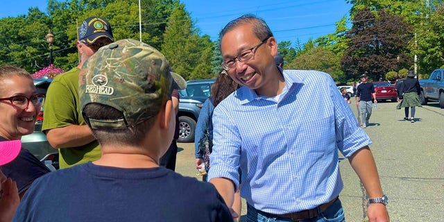 Former Cranston, Rhode Island Mayor Allan Fung, the Republican nominee in the state's 2nd Congressional District, speaks with voters in Hope, Rhode Island, on Sept. 18, 2022.