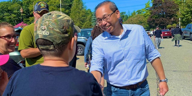 Former Cranston, Rhode Island Mayor Allan Fung, the Republican nominee in the state's 2nd Congressional District, speaks with voters in Hope, Rhode Island, on Sept. 18, 2022.