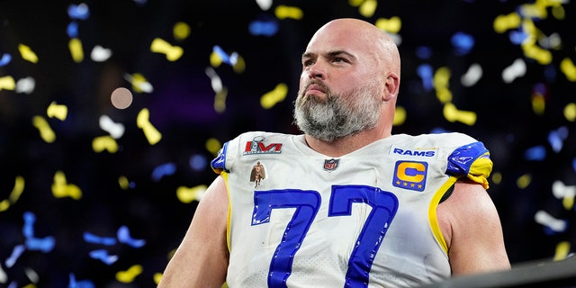 Andrew Whitworth, of the Los Angeles Rams, stands up at the podium after the Rams defeat the Cincinnati Bengals 23-20 in an NFL Super Bowl LVI football game at SoFi Stadium in Inglewood, California, Sunday, February 13, 2022.