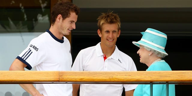 Andy Murray, left, of Great Britain and Jarkko Nieminen of Finland meet Queen Elizabeth II after their Wimbledon match on June 24, 2010, in London.