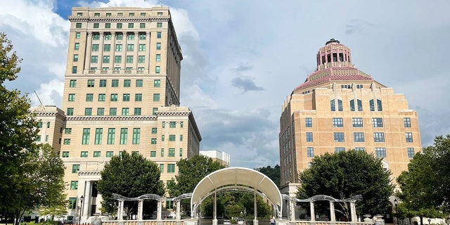 The Buncombe County Courthouse, left, and Asheville City Hall, right, are both in the Downtown Asheville Historic District and are listed on the National Register of Historic Places.