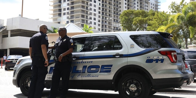 FILE - Police officers respond to a call in Aventura, Florida on October 26, 2018.