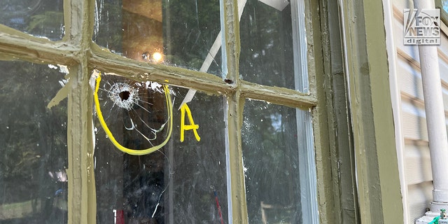 A bullet hole in a child's bedroom window in the home where police say Memphis gunman Ezekiel Kelly shot Dewayne Tunstall.