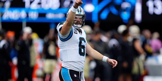 Carolina Panthers quarterback Baker Mayfield (6) celebrates a touchdown throw during the second half of an NFL football game against the New Orleans Saints, Sunday, Sept. 25, 2022, in Charlotte, N.C. 