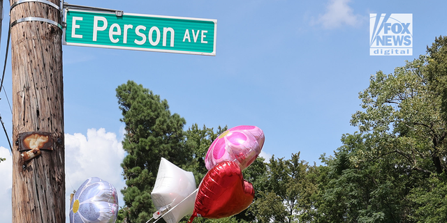 Balloons outside the house where the body of Eliza Fletcher was found.