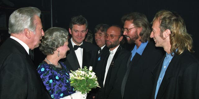 The Queen meets The Bee Gees backstage at the Royal Variety Performance in 1993.   