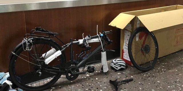 Barnes had to box up his bicycle to fly it from Alaska to Hawaii. Once he got to Hawaii, he had to unpack (pictured here) and reassemble it, so he could ride it to the capitol building.