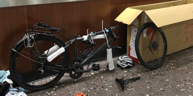 Barnes had to box up his bicycle to fly it from Alaska to Hawaii. Once he got to Hawaii, he had to unpack (pictured here) and reassemble it, so he could ride it to the capitol building.