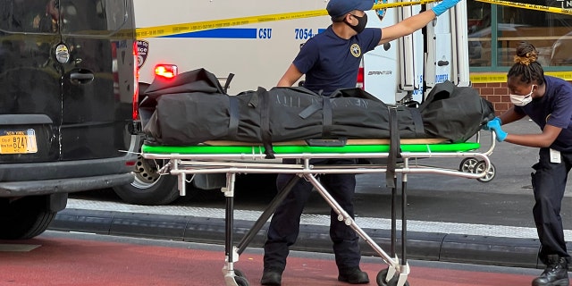 Body of 25-year-old victim removed from East Village street.