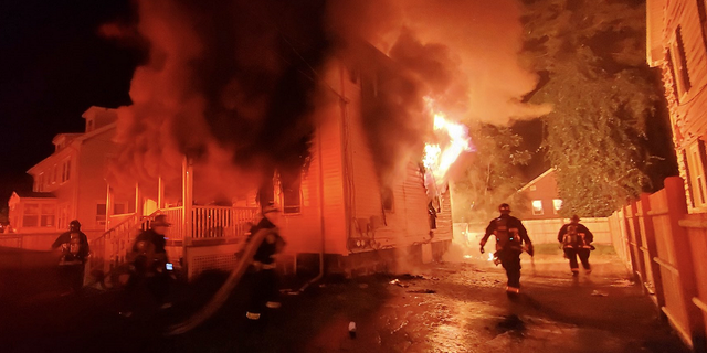 Boston Fire Department responds to the 3-alarm blaze early Saturday at a property in the city's Roslindale neighborhood.