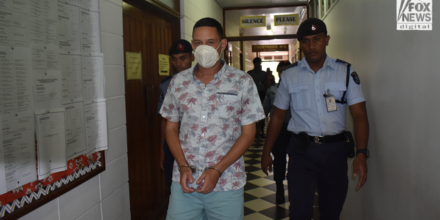 Bradley Dawson is escorted back to his cell after a judge denied his request for bail.  Dawson is accused of murdering his wife while the newlyweds were on a luxury honeymoon in 