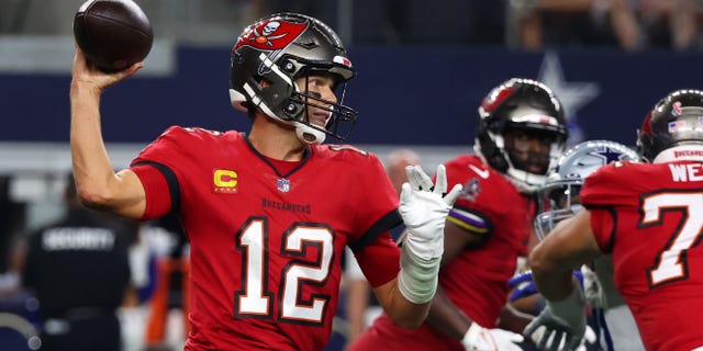 Tom Brady #12 of the Tampa Bay Buccaneers throws against the Dallas Cowboys during the first half at AT&amp;T Stadium on September 11, 2022, in Arlington, Texas.