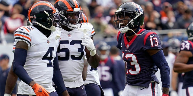 Houston Texans wide receiver Brandin Cooks, #13, yells towards Chicago Bears' Eddie Jackson, #4, and Nicholas Morrow, #53, during the first half of an NFL football game Sunday, the 25th September 2022 in Chicago.