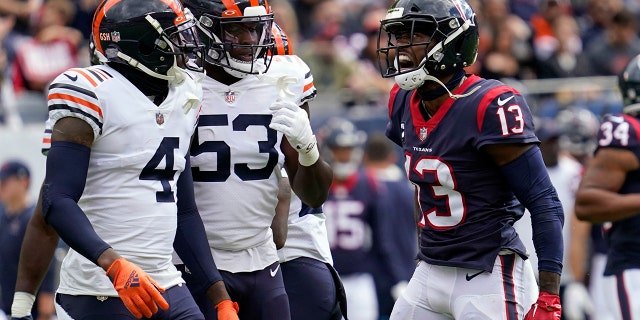 Houston Texans wide receiver Brandin Cooks (13) yells toward Chicago Bears' Eddie Jackson (4) and Nicholas Morrow (53) during the first half of an NFL football game Sunday, Sept. 25, 2022, in Chicago.