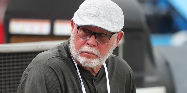 Bruce Arians, former head coach and current senior adviser to the general manager, sits on the bench before a preseason game between the Miami Dolphins Aug. 13, 2022, at Raymond James Stadium in Tampa, Fla.