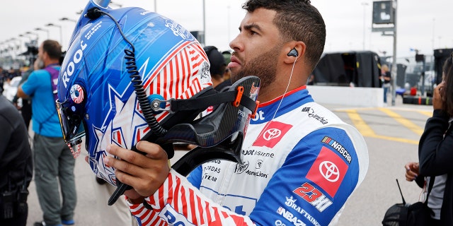 Bubba Wallace prepares for qualifying for the NASCAR Cup Series auto race at Kansas Speedway in Kansas City, Kan., Saturday, Sept. 10, 2022.