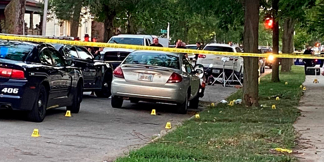Evidence markers dot the scene in Richmond, Indiana, where Richmond Police Department Officer Seara Burton was fatally wounded, and a man was injured in a shootout following a traffic stop.