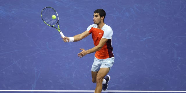 Carlos Alcaraz of Spain returns a shot against Casper Ruud of Norway during their Men's Singles Final match on Day Fourteen of the 2022 US Open at USTA Billie Jean King National Tennis Center on September 11, 2022 in the Flushing neighborhood of the Queens borough of New York City.
