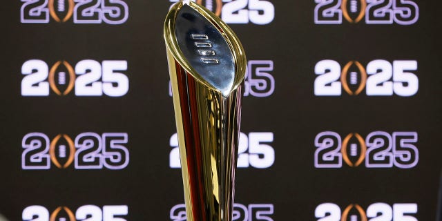The National Championship Trophy is displayed following a news conference Aug. 16, 2022, in Atlanta, announcing that the CFP National Championship NCAA college football game will be played at Mercedes-Benz Stadium in 2025. The conference commissioners who manage the College Football Playoff met for almost seven hours Tuesday, Sept. 27, to work on expanding the postseason system from four to 12 teams as soon as the 2024 season. There is still much work to be done.