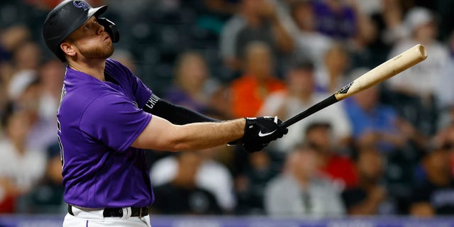 C.J. Cron of the Colorado Rockies watches his three-run home run in the seventh inning against the Texas Rangers at Coors Field Aug. 23, 2022, in Denver.