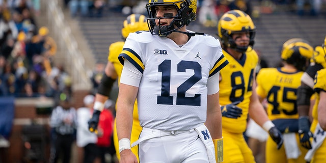 Cade McNamara of the Wolverines walks to the sideline during the spring game on April 2, 2022, in Ann Arbor, Michigan.