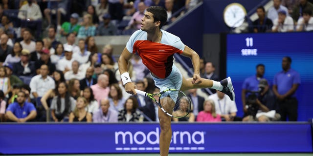 Carlos Alcaraz of Spain serves against Frances Tiafoe of the United States during their Men’s Singles Semifinal match on Day Twelve of the 2022 US Open at USTA Billie Jean King National Tennis Center on September 09, 2022 in the Flushing neighborhood of the Queens borough of New York City.