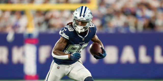 CeeDee Lamb #88 of the Dallas Cowboys runs with the ball after a catch against the New York Giants on September 26, 2022 at MetLife Stadium in East Rutherford, New Jersey.