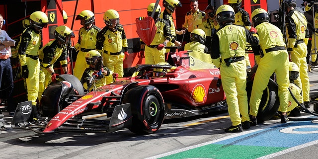 Ferrari driver Charles Leclerc gets a pit service during the Italian Grand Prix, Sunday, Sept. 11, 2022.