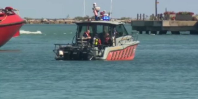 First responders in Chicago use boats to search for a 3-year-old boy in Lake Michigan.