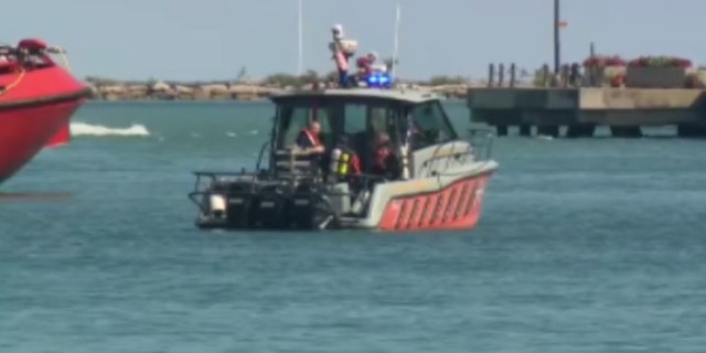 First responders in Chicago use boats to search for a 3-year-old boy in Lake Michigan.