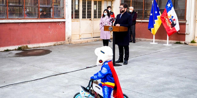 Chile's President Gabriel Boric, right, holds a press conference after casting his vote in a plebiscite on a new draft of the Constitution in Punta Arenas, Chile, Sunday, Sept. 4, 2022.