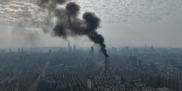 Flames and smoke rise from an office building on Sept. 16, 2022 in Changsha, Hunan Province of China.