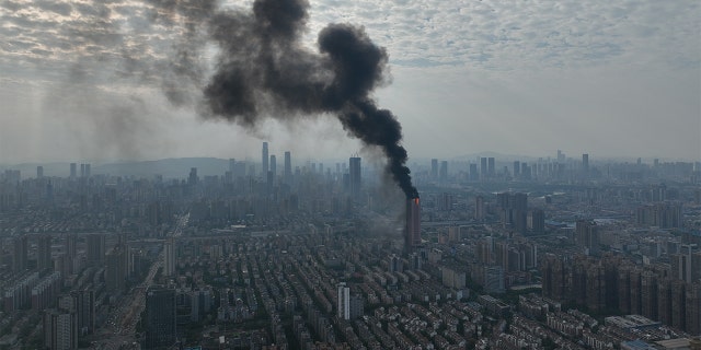 Flames and smoke rise from an office building on Sept. 16, 2022 in Changsha, Hunan Province of China.