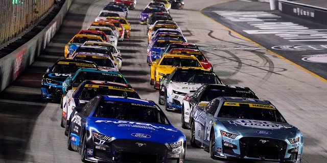 Chris Buescher, front left, and Kevin Harvick lead the pack at Bristol Motor Speedway Saturday, Sept. 17, 2022, in Bristol, Tennessee.