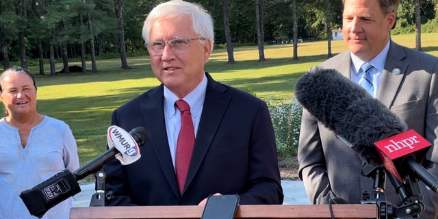 State Senate President Chuck Morse, with Gov. Chris Sununu, right, takes questions from reporters, in Concord, New Hampshire, on Sept. 8, 2022.