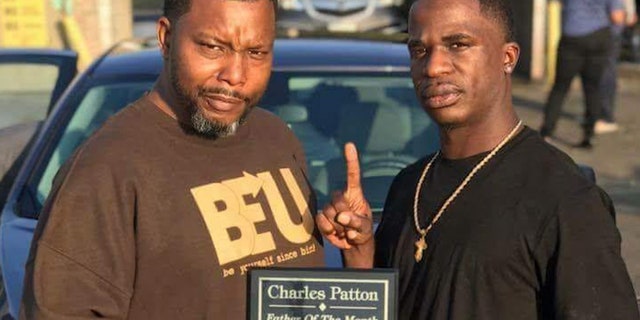 Saulter hands out a Father of the Month award in 2017 to Charles Patton. He said Patton honored his responsibilities as a father despite tough experiences.