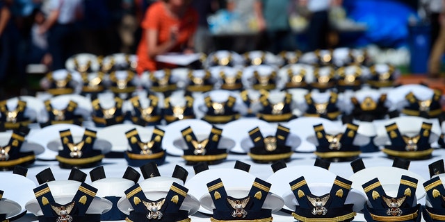 The new hats and shoulder bars for the graduates sit on a table before the start of the U.S. Coast Guard Academy's 141st Commencement Exercises Wednesday, May 18, 2022, in New London, Conn.