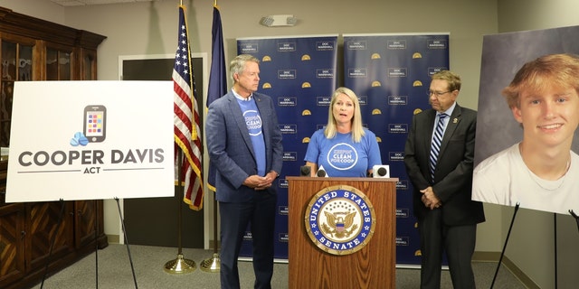 Libby Davis and Kansas Sen.  Roger Marshall announces the Cooper Davis Act.