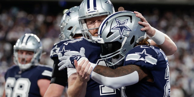 Dallas Cowboys running back Ezekiel Elliott (#21) and Dallas Cowboys quarterback Cooper Rush (#10) after scoring a touchdown against the New York Giants during the third quarter of an NFL football game. Celebrating Together, Monday, September 26, 2022, in East Rutherford, New Jersey. 