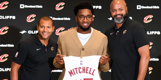 Cleveland Cavaliers president of basketball operations Koby Altman, left, Donovan Mitchell and head coach J.B. Bickerstaff pose for a photo during a press conference where Mitchell was introduced at Rocket Mortgage FieldHouse in Cleveland on Sept. 14, 2022.