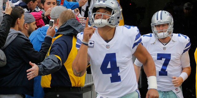 Dallas Cowboys quarterback Dak Prescott (4) and quarterback Cooper Rush (7) head for the field before the game as the Dallas Cowboys play the Washington Redskins on Sunday, Oct. 29, 2017 at FedEx Field in Landover, Md.