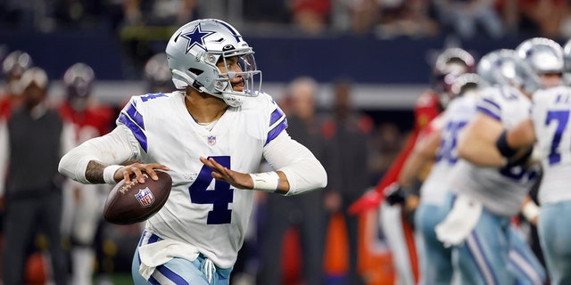 Dallas Cowboys quarterback Dak Prescott rolls out of the pocket against the Tampa Bay Buccaneers in Arlington, Texas, Sunday, Sept. 11, 2022.